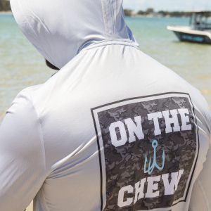 281A8220 Fishing and lifestyle clothing. On The Chew <ul class="mybullet"> <li>Light weight hooded jersey with a built in franga</li> <li>Custom polyester blend for total comfort</li> <li>Soft & smooth 4-way stretch</li> <li>Ventilated for ultimate breathability</li> <li>Moisture wicking & fast drying</li> <li>UPF 30+ sun protection with collar</li> <li>Please note that due to variations amongst screens and photo lighting, actual colours may vary</li> </ul> <p style="text-align: center;">[button size="medium" style="secondary" text="Click to get in the box in a TEE" link="https://onthechew.com.au/product/in-the-box-tee/"]</p> $79.99