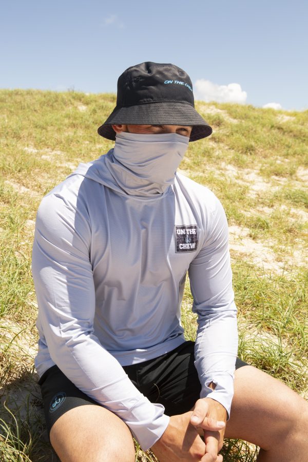 281A8247 scaled Fishing and lifestyle clothing. On The Chew <ul class="mybullet"> <li>Light weight hooded jersey with a built in franga</li> <li>Custom polyester blend for total comfort</li> <li>Soft & smooth 4-way stretch</li> <li>Ventilated for ultimate breathability</li> <li>Moisture wicking & fast drying</li> <li>UPF 30+ sun protection with collar</li> <li>Please note that due to variations amongst screens and photo lighting, actual colours may vary</li> </ul> <p style="text-align: center;">[button size="medium" style="secondary" text="Click to get in the box in a TEE" link="https://onthechew.com.au/product/in-the-box-tee/"]</p> $79.99